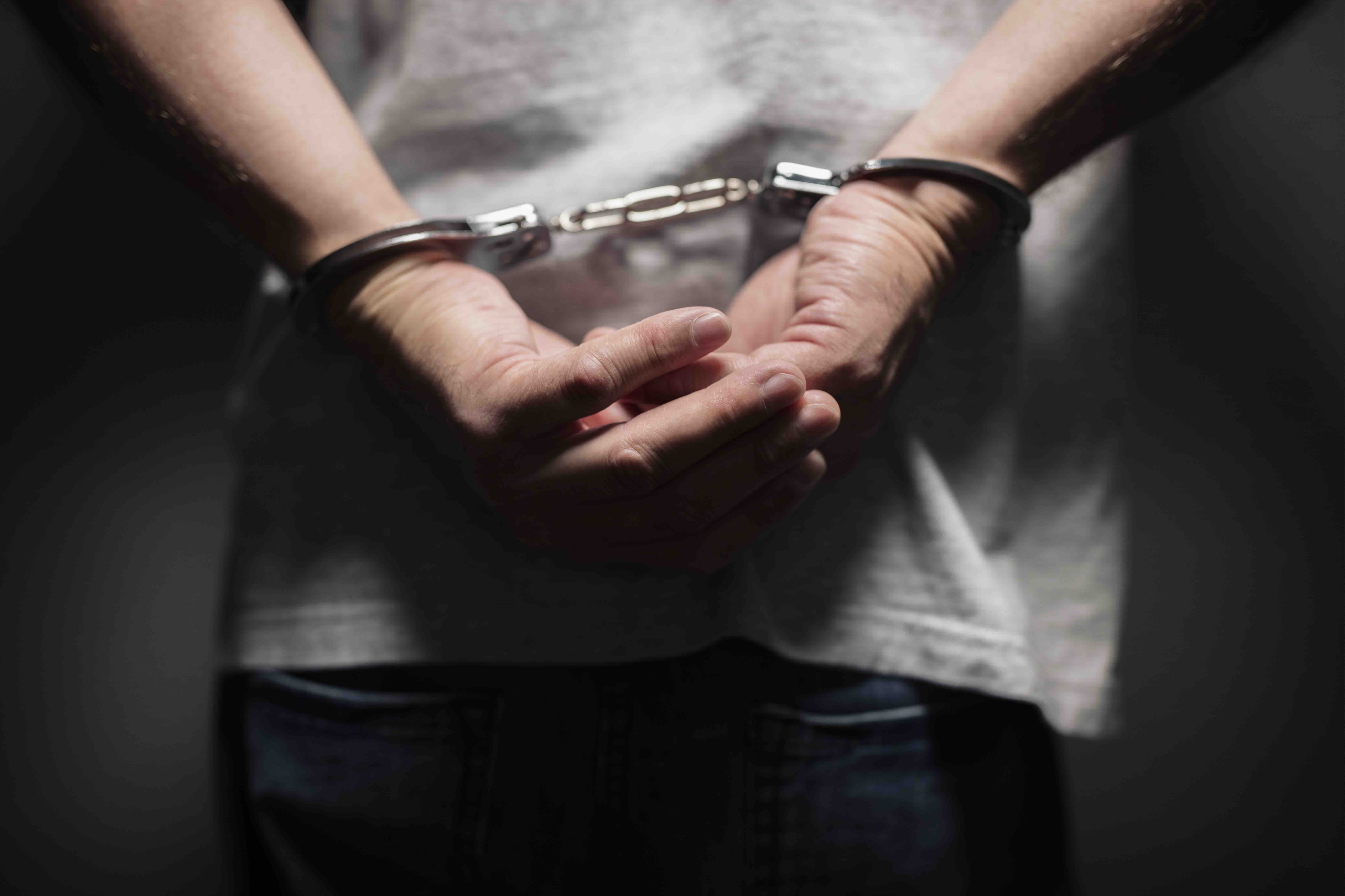 Criminal Arrested in Handcuffs