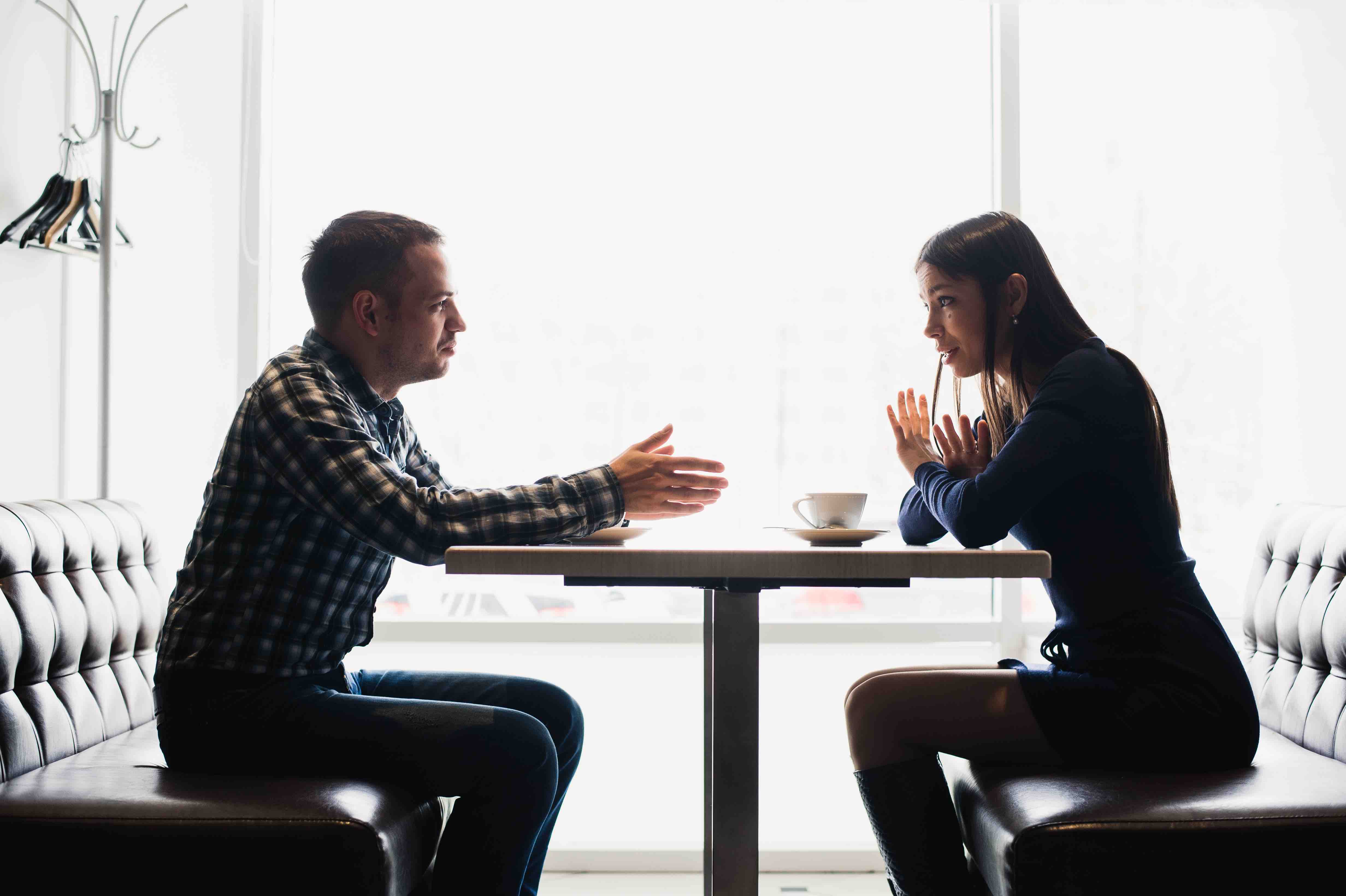 Man and Woman at table talking