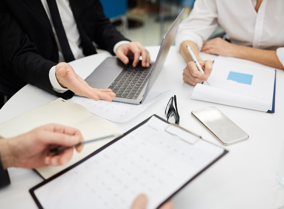 Business Lawyers at table with computer and papers