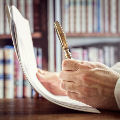 Hands holding paper and pen